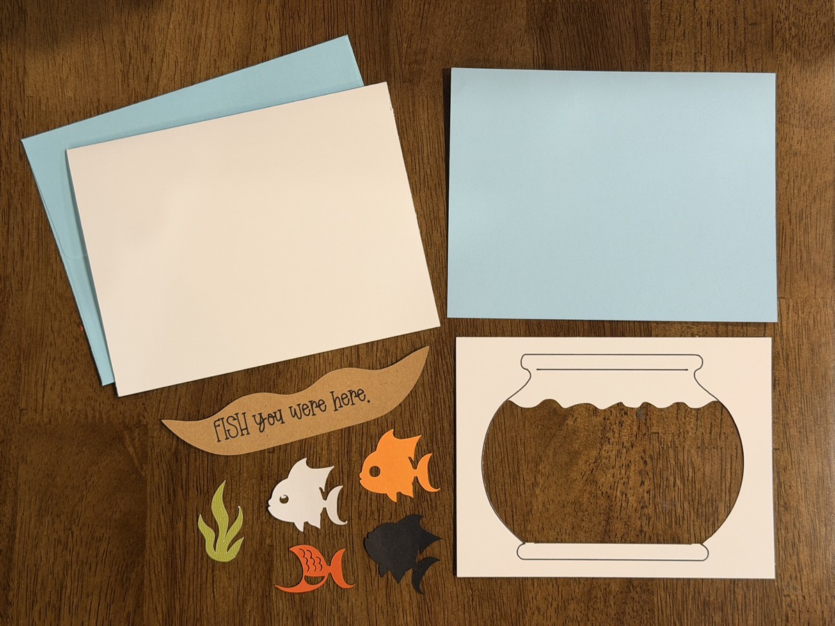 Fish You Were Here card kit pieces laid out before assembly.