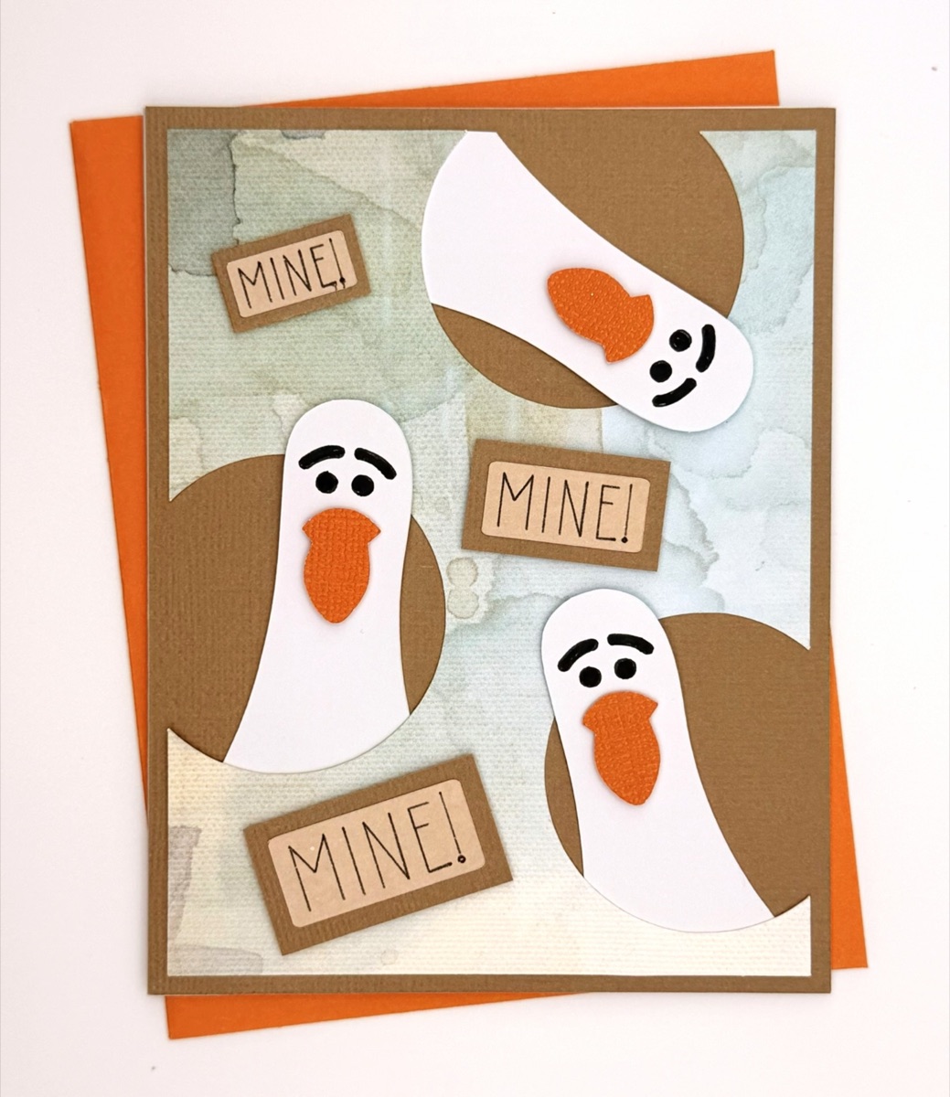 Finished Seagull MINE handmade card with seagulls and orange envelope.
